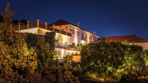 A two-story building with a balcony and a garden area. - The gateway to the magnificent Douro Valley. High-value wine tourism! (Santa Marta de Penaguião)