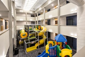 A multi-level indoor play area with various play structures and a metal safety enclosure. - ML 116: Mountain Vibes & Lift Views – Perfect Summer Escape (Snowshoe)