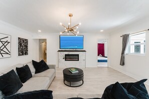 TV, fireplace - Villa Velvet ~ Heated Pool, Jacuzzi, Game Room & Minutes to Beaches (Pembroke Pines)