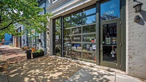 A storefront with large glass windows, a sign for 'Swirl' cocktails, supper, and events, and the number 906 on the door. - Free Parking, Walking Distance, Camden Yards, M&T Stadium, U of MD, Convention (Baltimore)