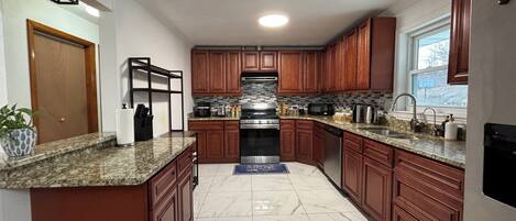 Coffee/tea maker, fridge, microwave, oven