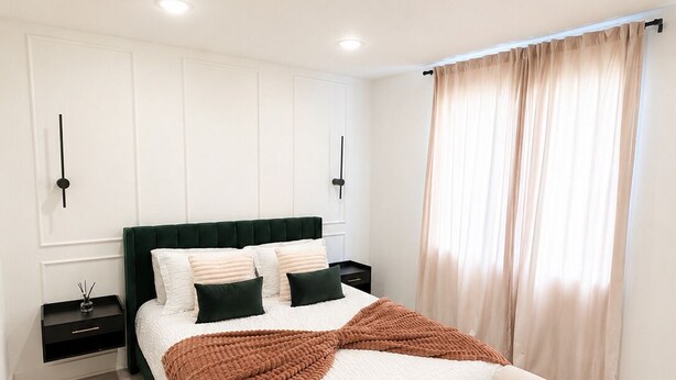 A bedroom with a bed, nightstands, a window with curtains, and recessed ceiling lights. - Elegant Downtown Dallas Retreat (Dallas)