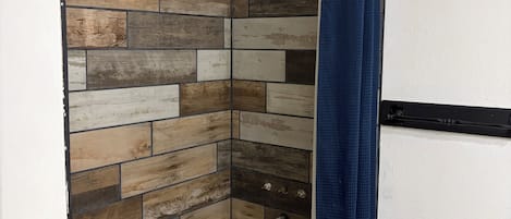 Shower, towels, soap, toilet paper