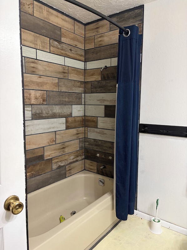 Shower, towels, soap, toilet paper