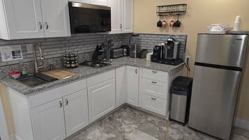 Fridge, microwave, stovetop, coffee/tea maker