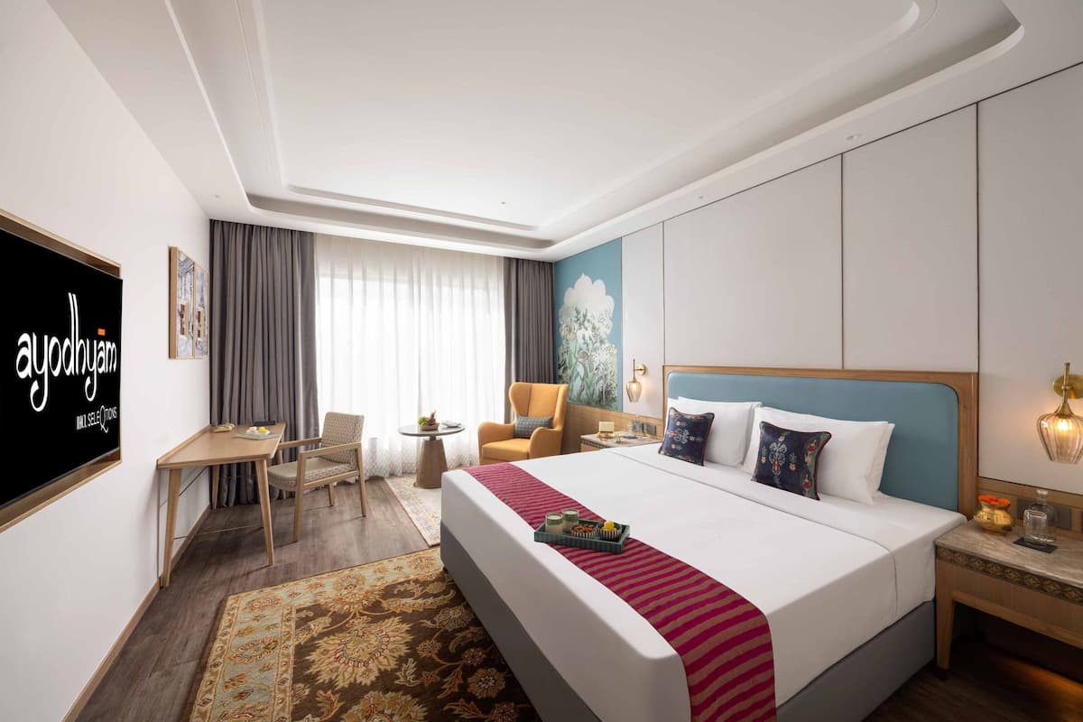 Habitación superior, 1 cama King size | Ropa de cama de alta calidad y caja de seguridad en la habitación