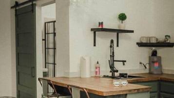 Fridge, microwave, coffee/tea maker, cookware/dishes/utensils