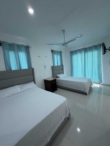 Room with double bed + single bed in Xul-Ha