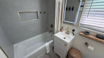 Hair dryer, towels, soap, toilet paper