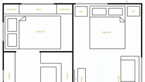 A floor plan with a main bed, a desk, a table, a fridge, a storage area, and an outdoor seating area. - Elizabeth the spacious retro caravan. Sleeps 6 | Rye, Mornington Peninsula (Rye)