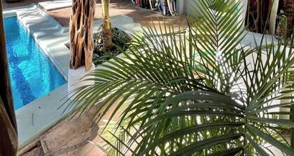 Private room with pool, walking distance to beach