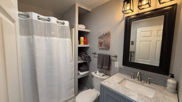 Shower, hair dryer, towels, soap