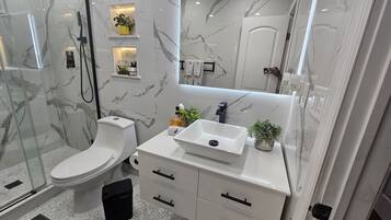 Shower, hair dryer, towels, soap