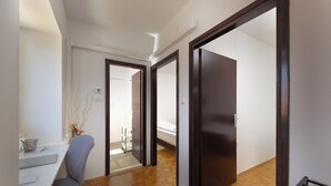 A hallway with a desk, chair, and a bed in the background. - Casa Valdebek with Pool, Pula, Croatia (Pula)
