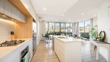 Fridge, oven, toaster, dining tables