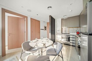 Fridge, microwave, oven, stovetop - Modern 1BR in Brand-New Cloud Tower in JVT (Dubai)
