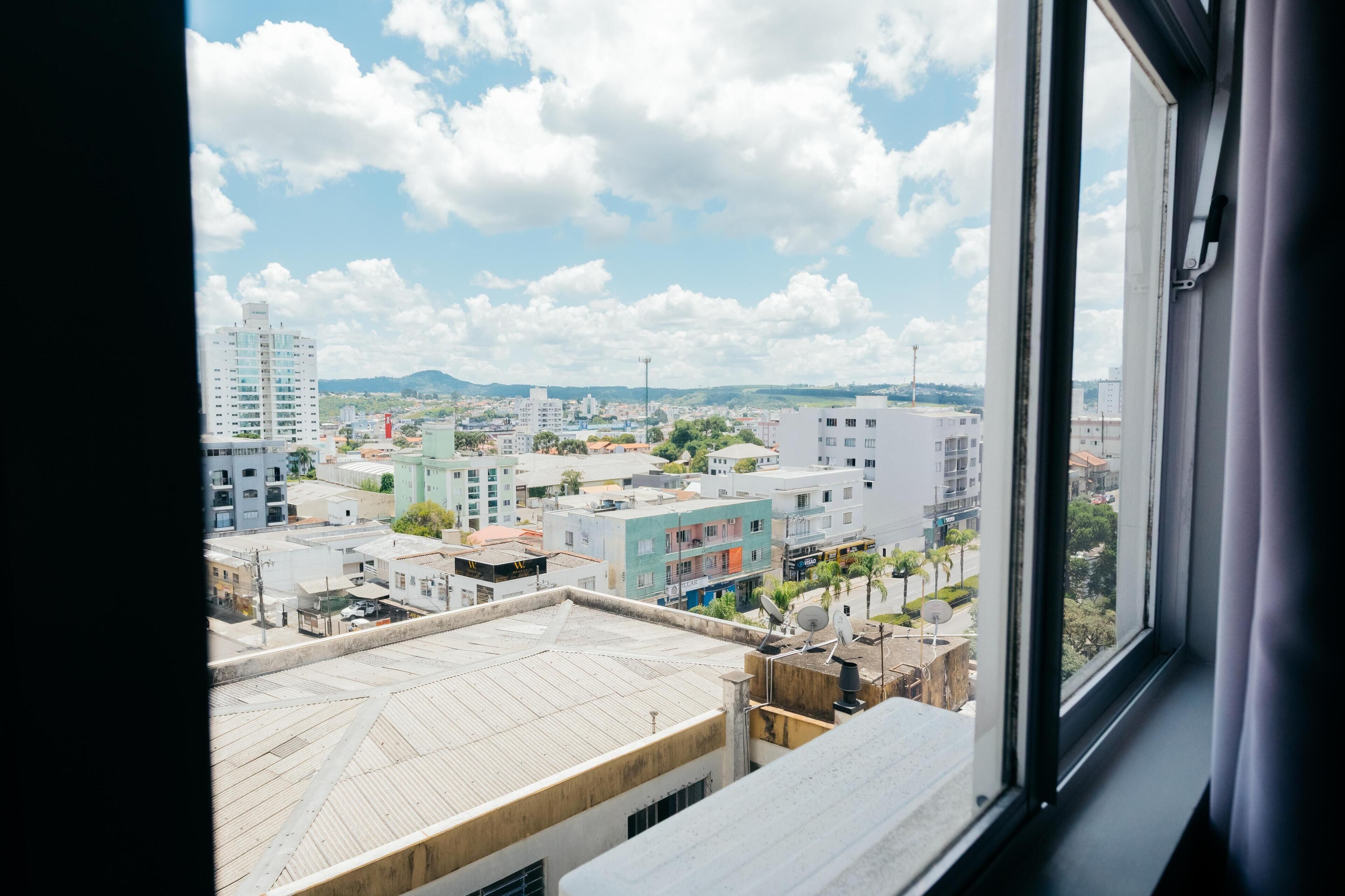 Quarto solteiro luxo, vista para a cidade | Roupas de cama antialérgicas, Wi-Fi de cortesia, roupa de cama