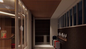 A corridor with tiled flooring, a wooden ceiling, and a wall with a luggage rack. - Just Sleep Taipei Zhongshan (Taipei)