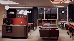 A modern restaurant with a bar area, multiple seating options, and a large window. - Just Sleep Taipei Zhongshan (Taipei)