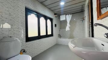 Bathtub, slippers, towels