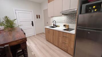 Fridge, microwave, stovetop, coffee/tea maker