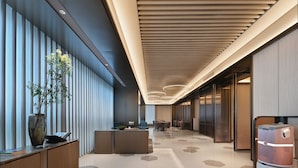 A modern hotel lobby with a reception desk, seating area, and a vending machine. - Crystal Orange Hotel Shenzhen Futian (Shenzhen)