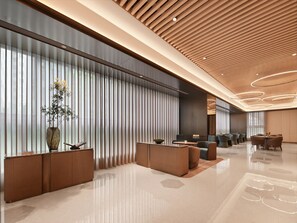 A modern hotel lobby with a reception desk, seating area, and a large window with vertical blinds. - Crystal Orange Hotel Shenzhen Futian (Shenzhen)