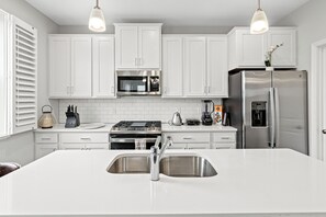 Private kitchen - A comfortable 3-bedroom home offers 5 beds and can accommodate up to 8 guests. (Rogers)