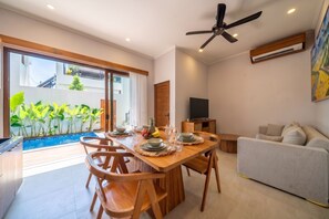 Vila premium, 5 quartos, vista para a piscina | Sala de jantar
