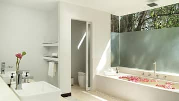 Separate bathtub and shower, hair dryer, slippers, towels
