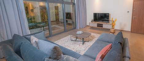 Apartment, 3 Bedrooms | Living area | 50-inch Smart TV with digital channels