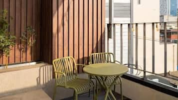 Luxury Suite, Balcony, City View | Outdoor dining
