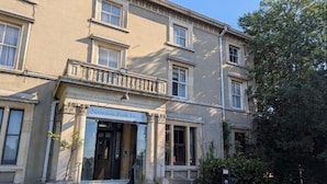 A two-story building with a sign reading 'Newton Park Hotel.' - Standard family room for 4(2A+2C) (Burton-On-Trent)