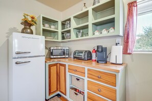 Fridge, microwave, coffee/tea maker, cookware/dishes/utensils