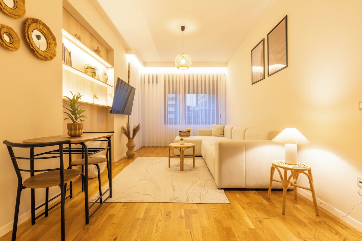 Design Apartment, City View | Living area | 50-inch Smart TV with digital channels