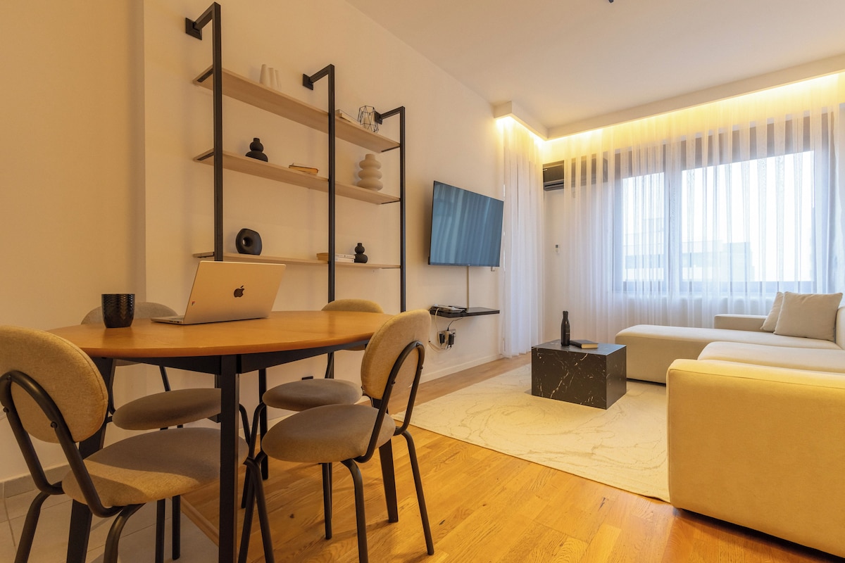 Premier Apartment, City View | Living area | 50-inch Smart TV with digital channels