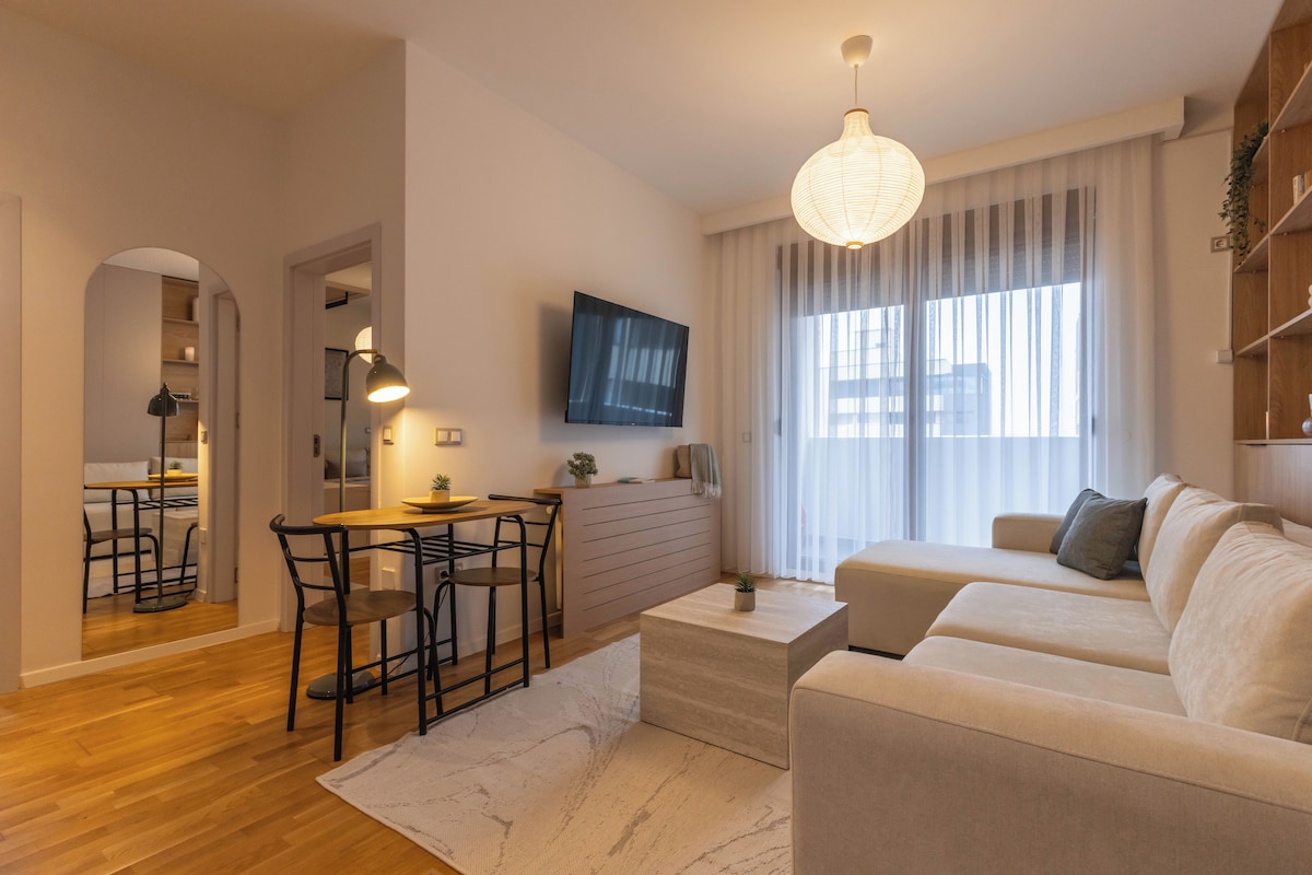 Economy Apartment, City View | Living area | 50-inch Smart TV with digital channels