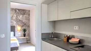 Fridge, microwave, cookware/dishes/utensils, dining tables