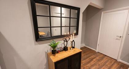 Sleeps six in style with three modern bathrooms, minutes from Wigan town centre