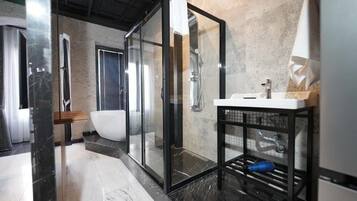 Separate bathtub and shower, free toiletries, hair dryer, slippers