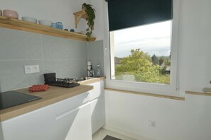 Private kitchen - "The Quiet Nest," a Cozy Studio by the Sea (Langrune-sur-Mer)