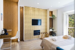 Deluxe Quadruple Room, Balcony, Hill View | Laptop workspace, iron/ironing board, free WiFi