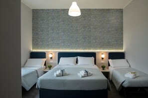 A hotel room with two beds, a large wall mural, and bedside lamps. - Camera Superior   Piazza Bologna (Roma)