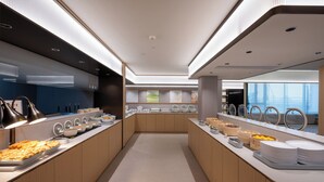 A modern kitchen with a central island, equipped with various food items and appliances. - JI Wuhan Jianghan Road Pedestrian Street (Wuhan)