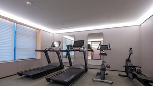 A modern gym with treadmills, an elliptical, and a stationary bike. - JI Wuhan Jianghan Road Pedestrian Street (Wuhan)