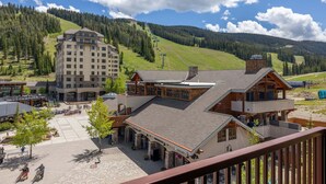 A hotel with a ski lift in the background, surrounded by a mountainous landscape. - New Listing! Ski In/Out + Pool + Hot Tub at Lift House (Big Sky)