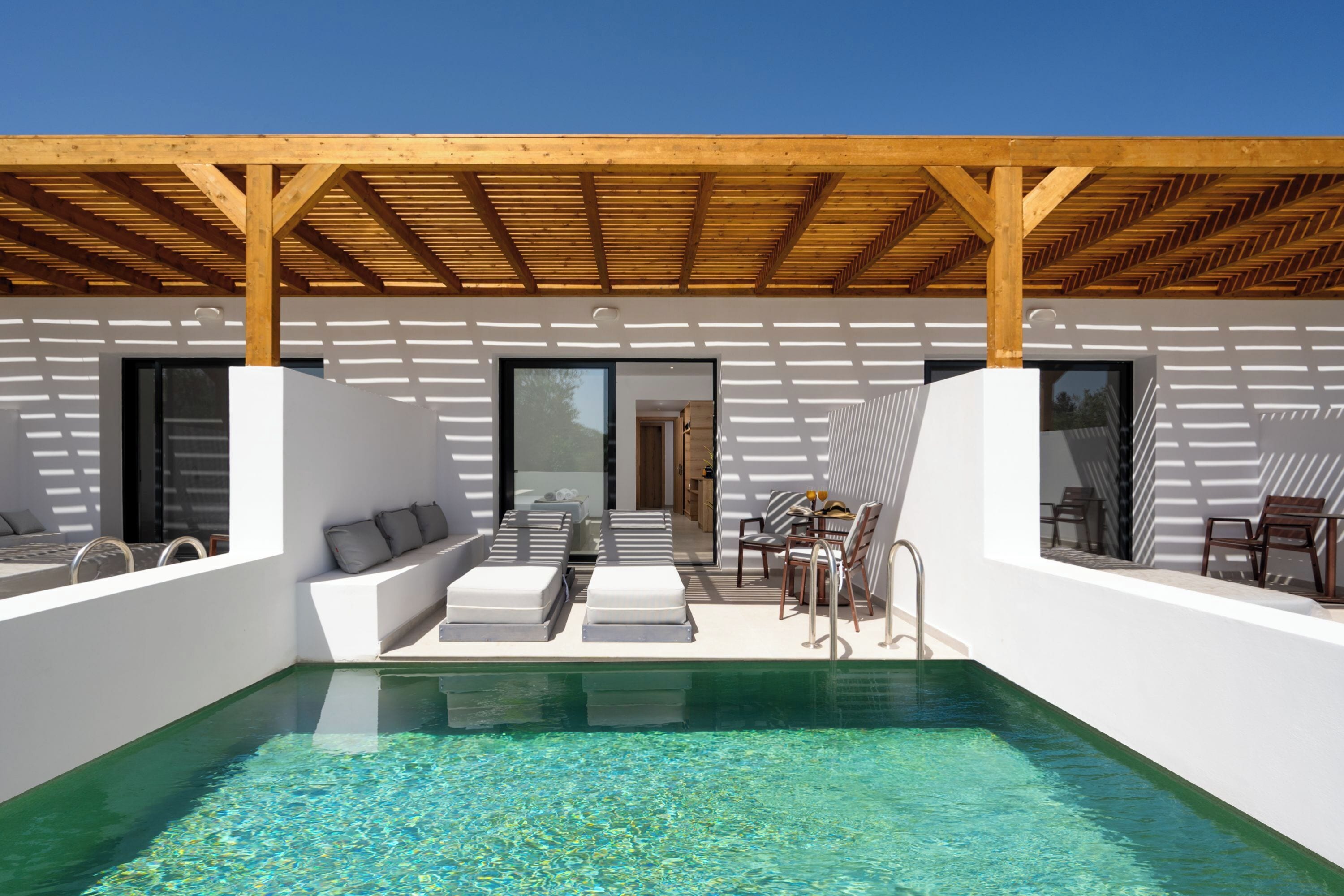 Suite, Pool View | In-room safe, soundproofing, iron/ironing board, free WiFi