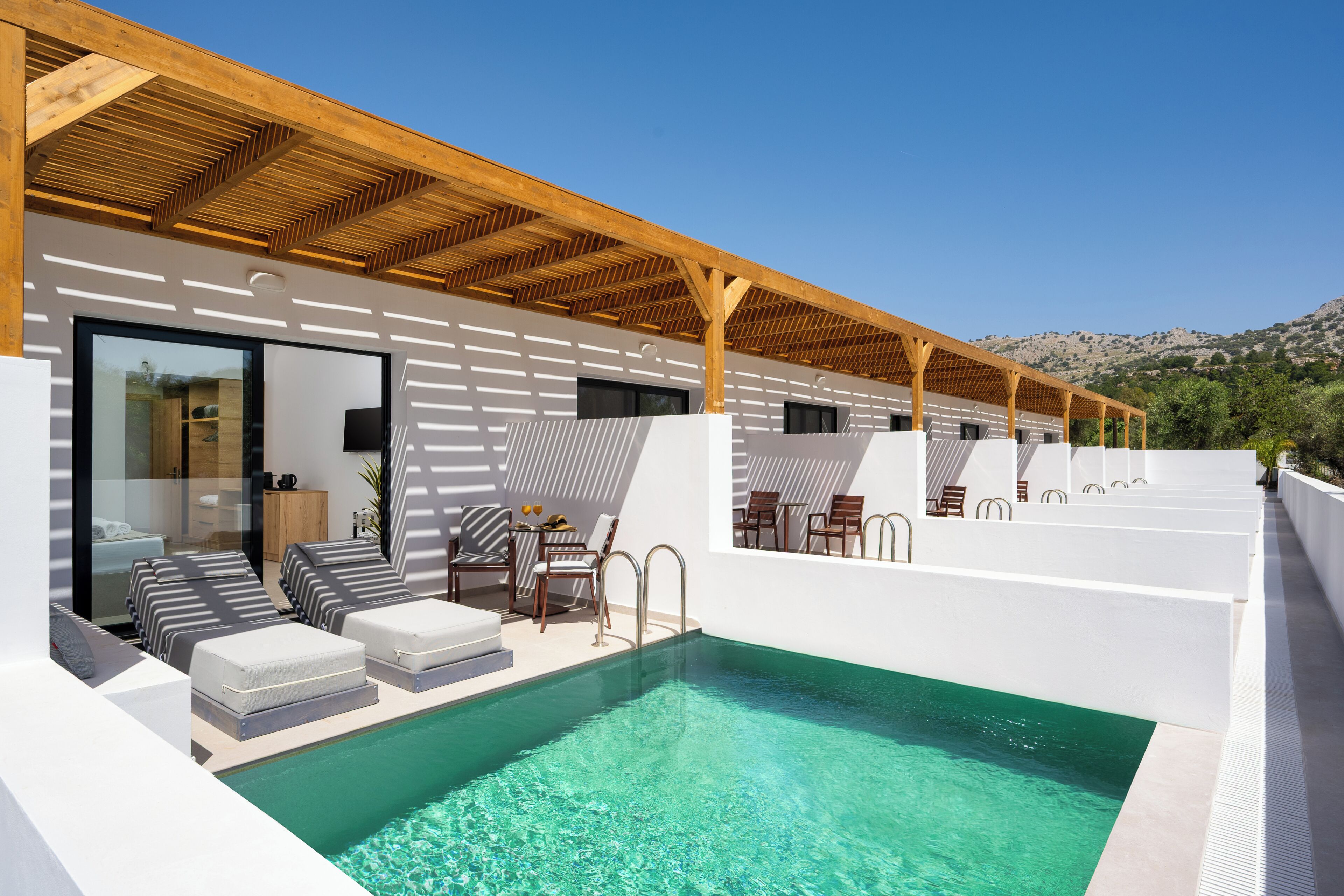 Suite, Pool View | In-room safe, soundproofing, iron/ironing board, free WiFi