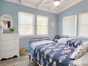 A bedroom with two beds, a dresser, a mirror, and a window with blinds. - Beach Haven South - Minutes from the Beach, Second Row North Litchfield (Pawleys Island)