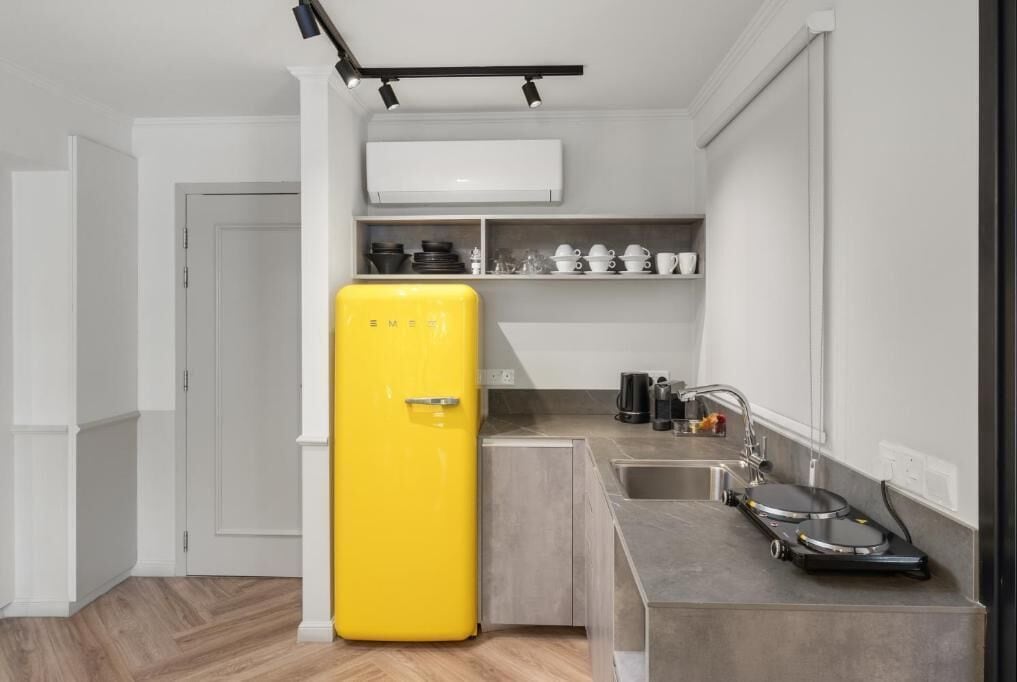Apartamento família, sacada | Cozinha privada